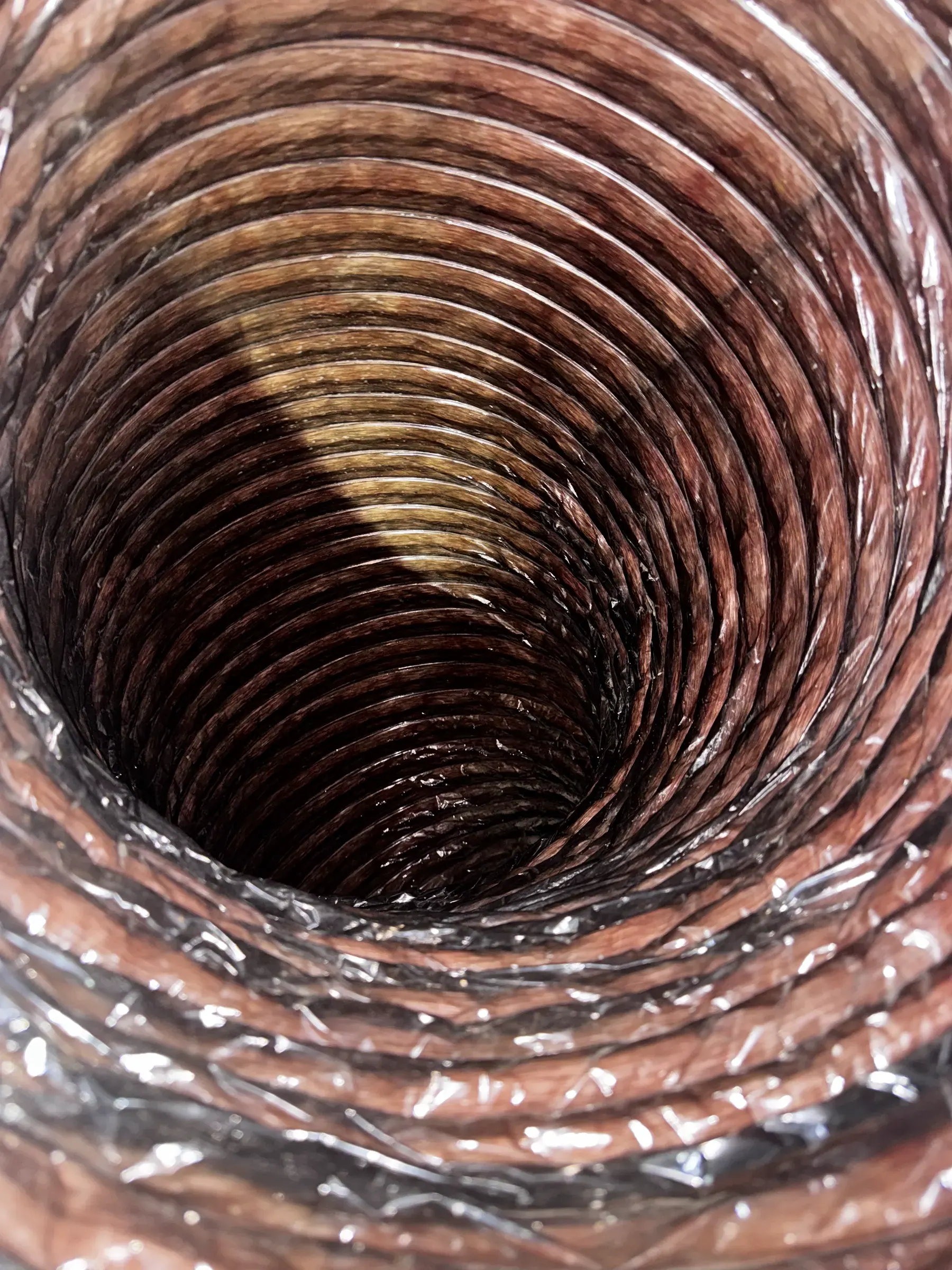 Interior view of a flexible duct with accumulated material