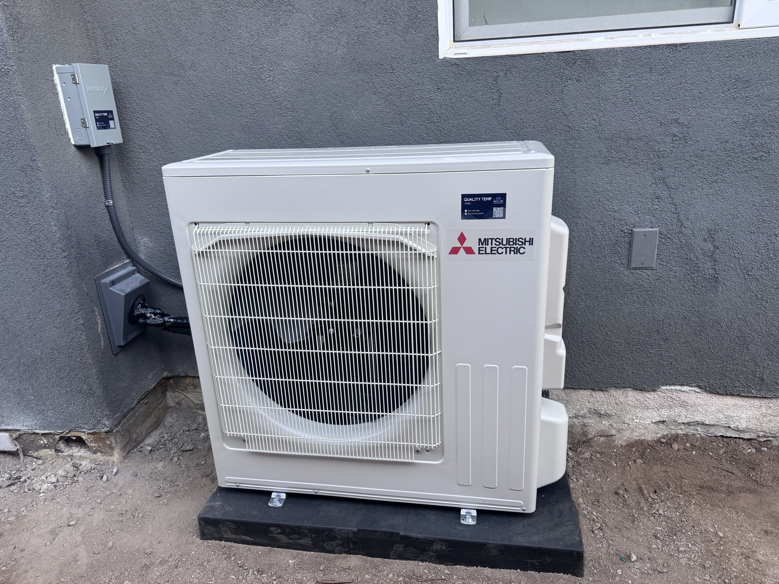 Mitsubishi Electric outdoor comfort system installed beside a home