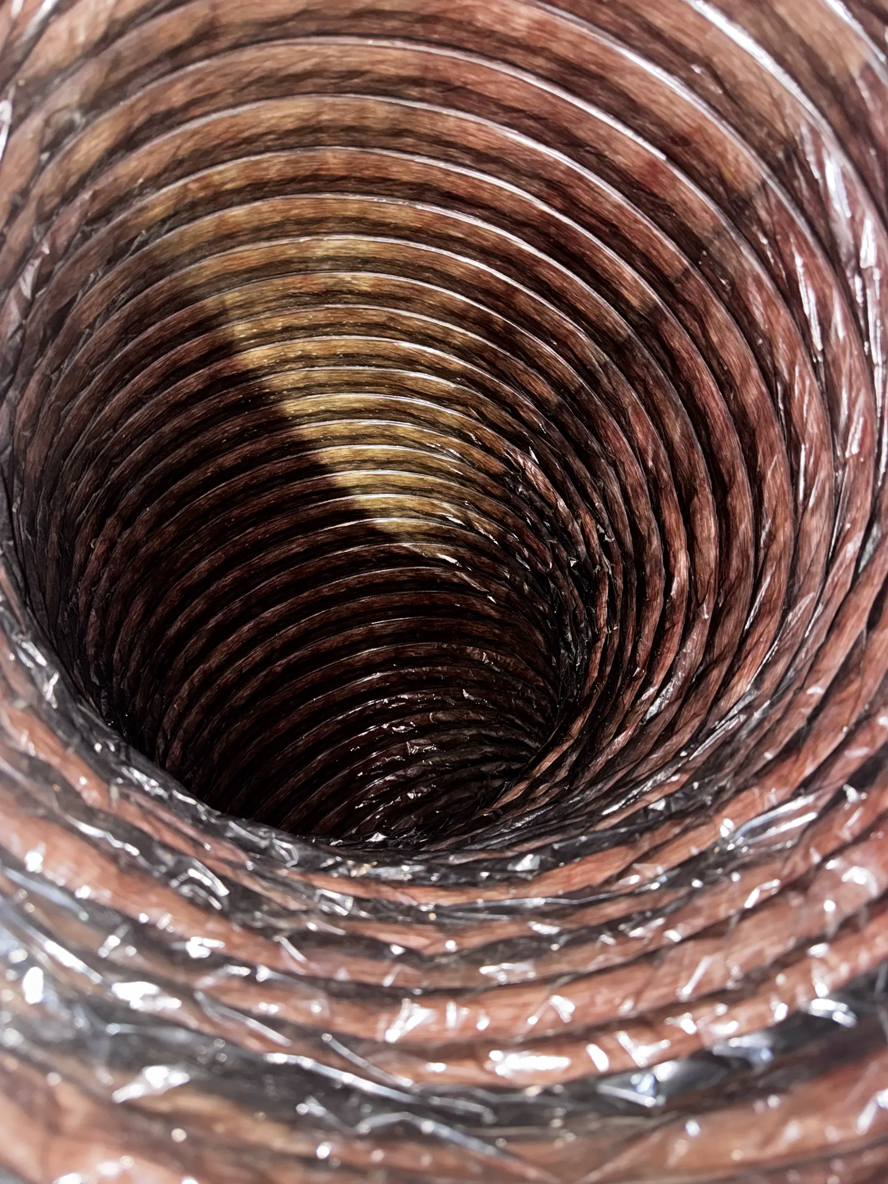 Interior view of a flexible duct with accumulated material