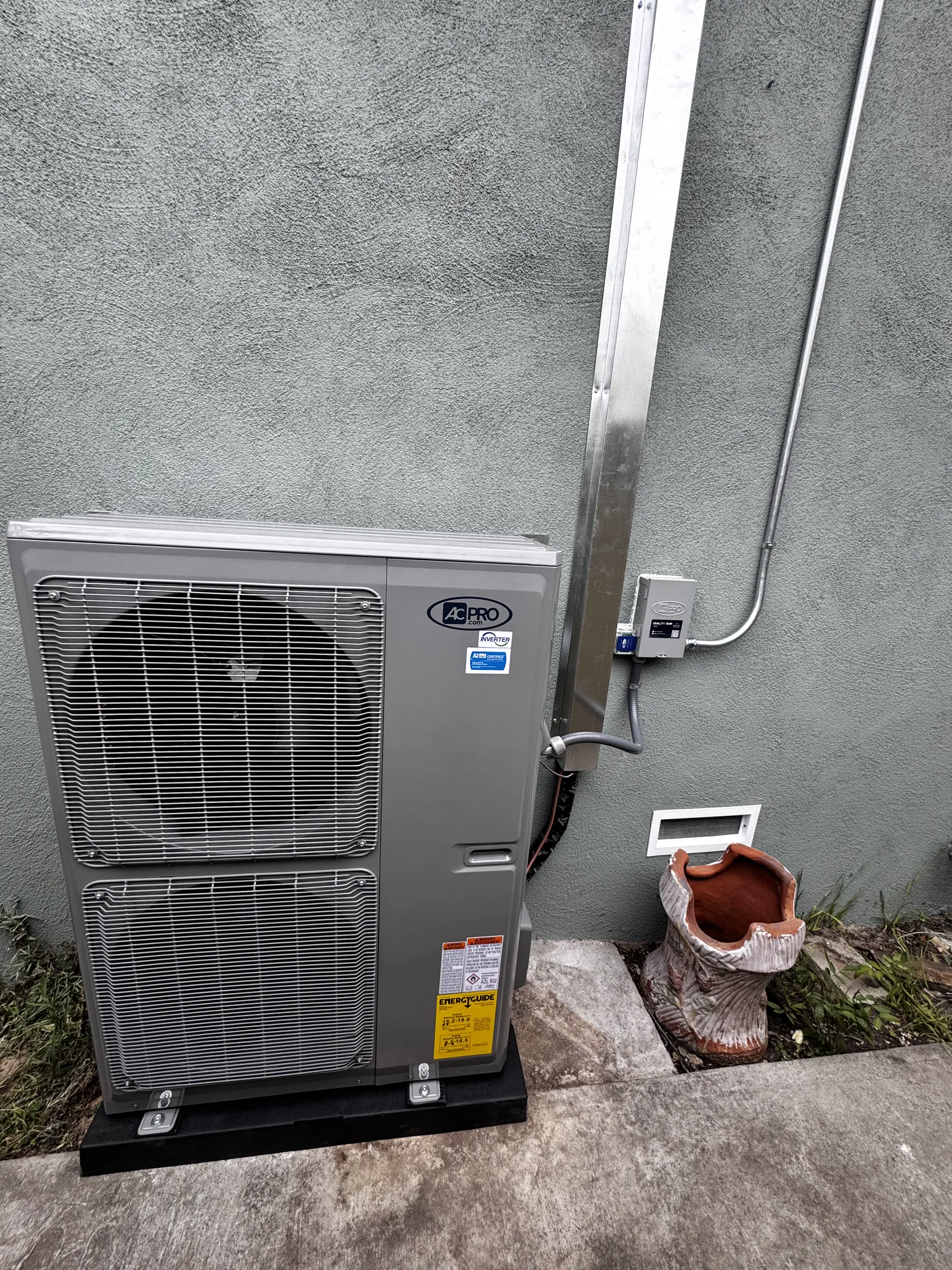 Outdoor condenser unit and service area photographed at a residential property